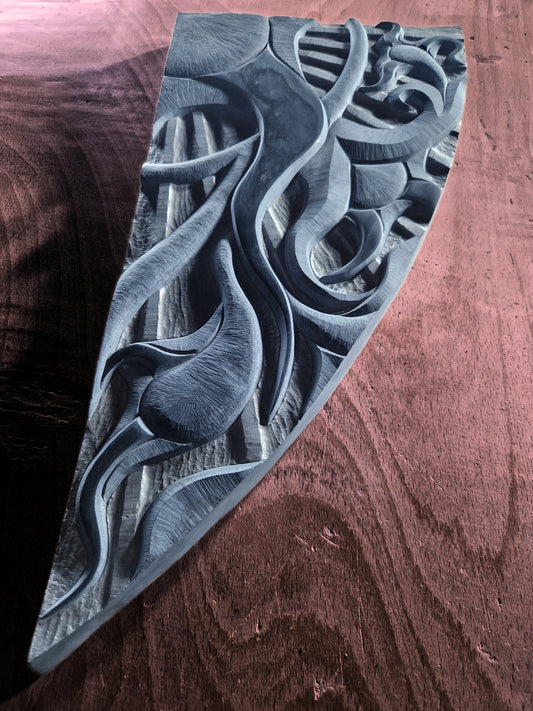 Handcarved abstract wall relief.